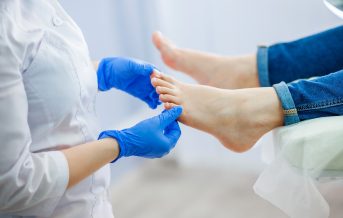 Podiatry doctor examines the foot Podiatry doctor examines the foot